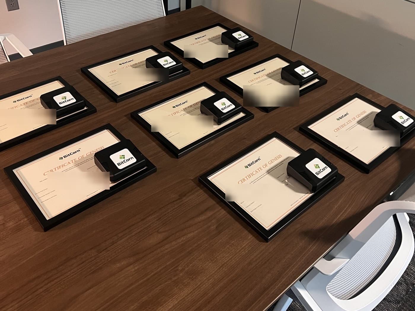 A set of BitCorn Nodes with their Certificates of Genesis, laid out and ready to ship